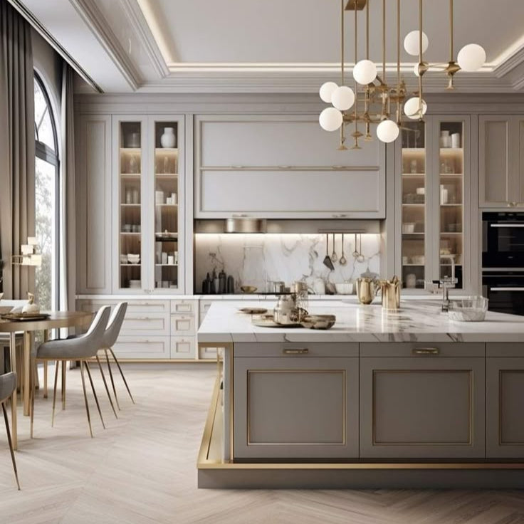 Elegant modern kitchen with marble island, gold accents, and contemporary dining set.